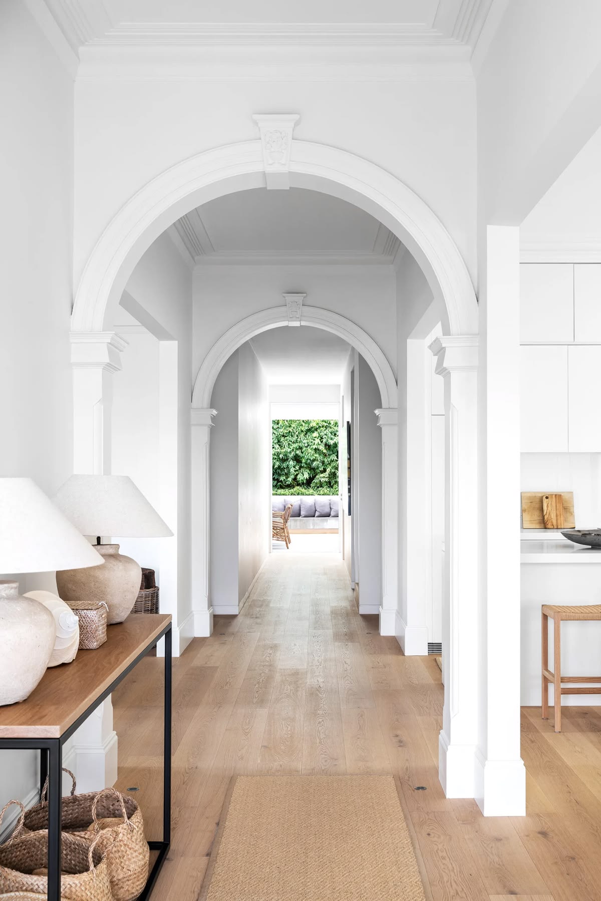 Arched hallway enfilade in a North Shore home, The Style Workshop