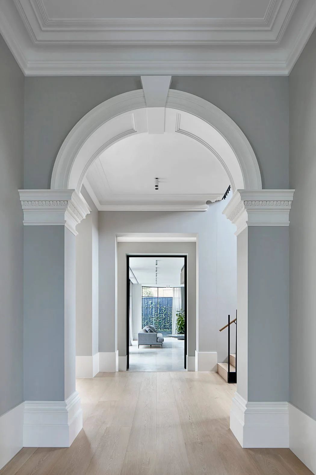Federation hallway archway with a staircase connecting to the upper level beyond