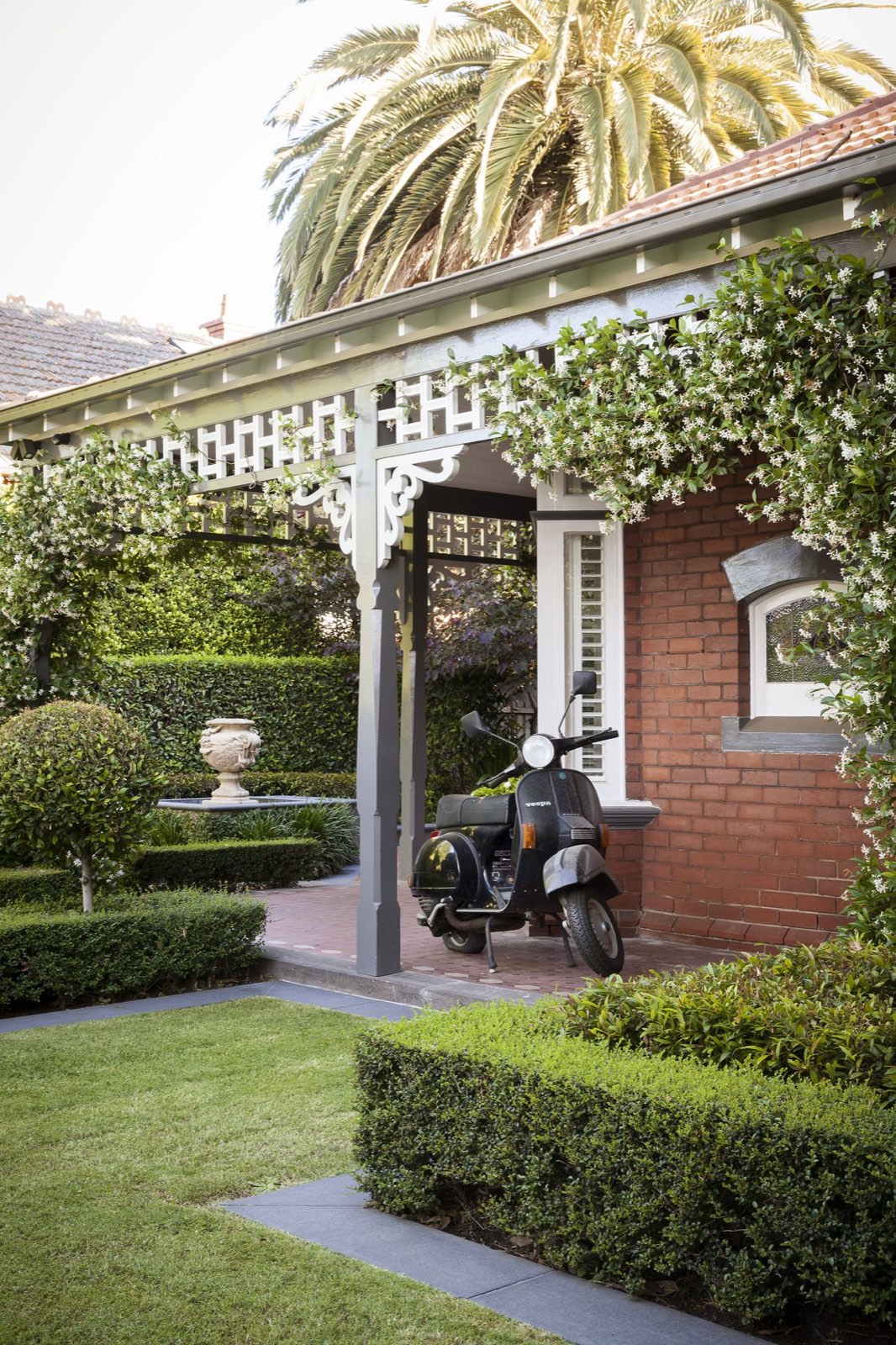 Ornate white timber fretwork on a Federation verandah gable