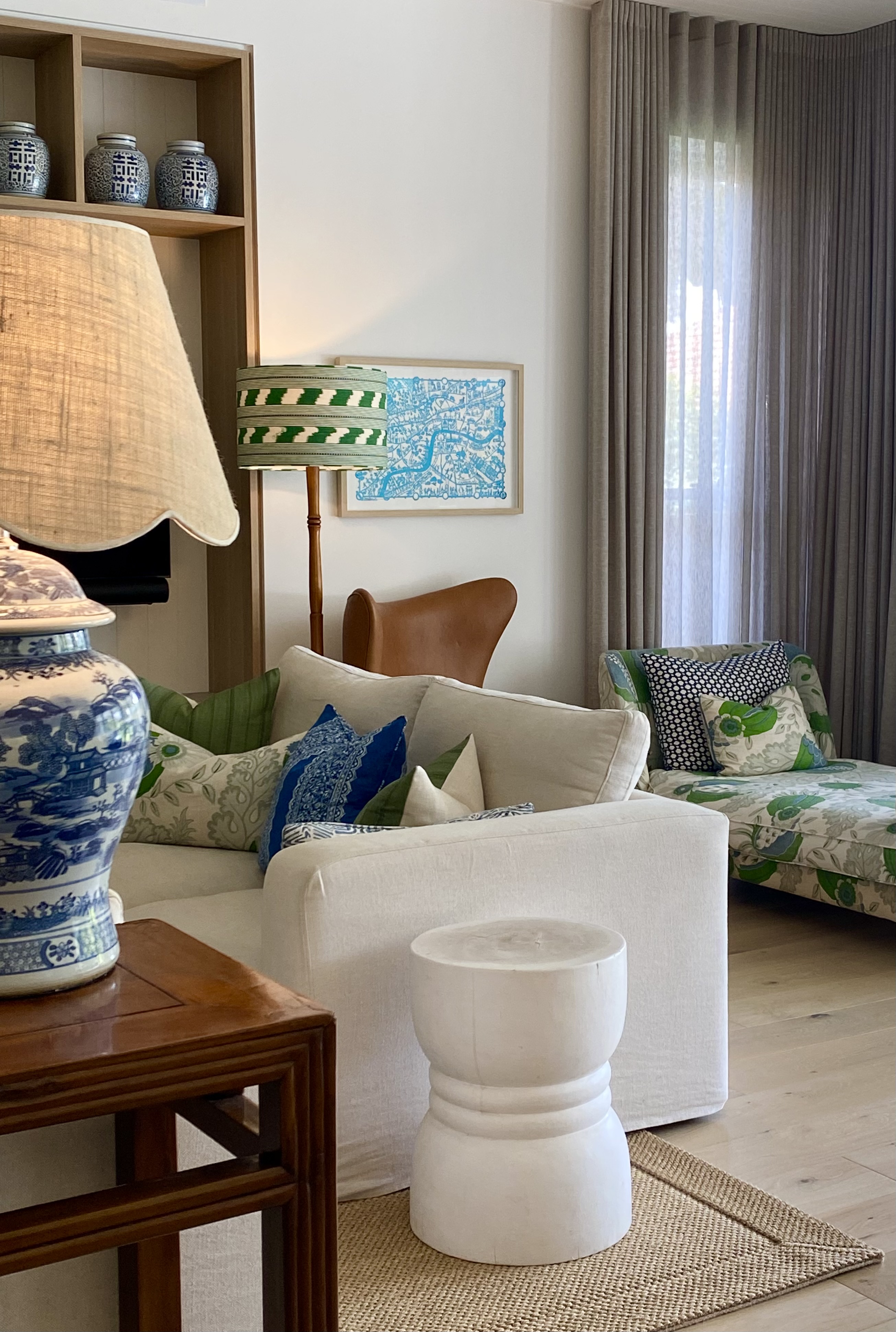 Floor lamp and table lamp layered together in a living room corner