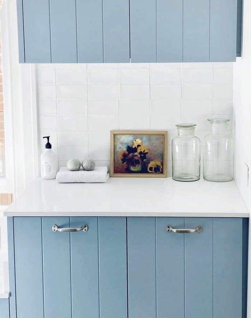 Small vintage still life painting in a contemporary blue laundry, The Style Workshop