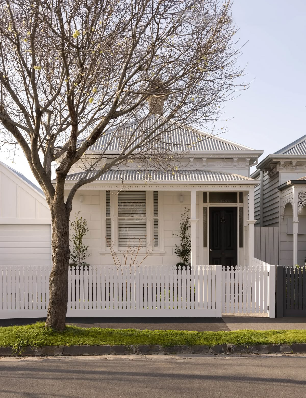 Exterior of a home with white painted walls and trims