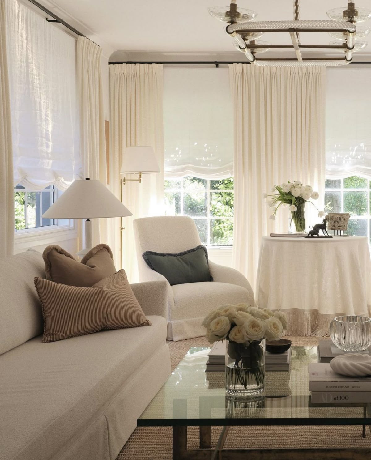 Interior with warm white walls, timber flooring and linen textiles