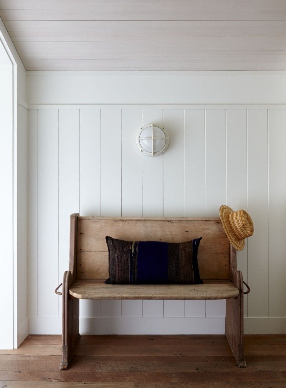 White V-groove panelling walls and limed ceiling panelling in a similar tone