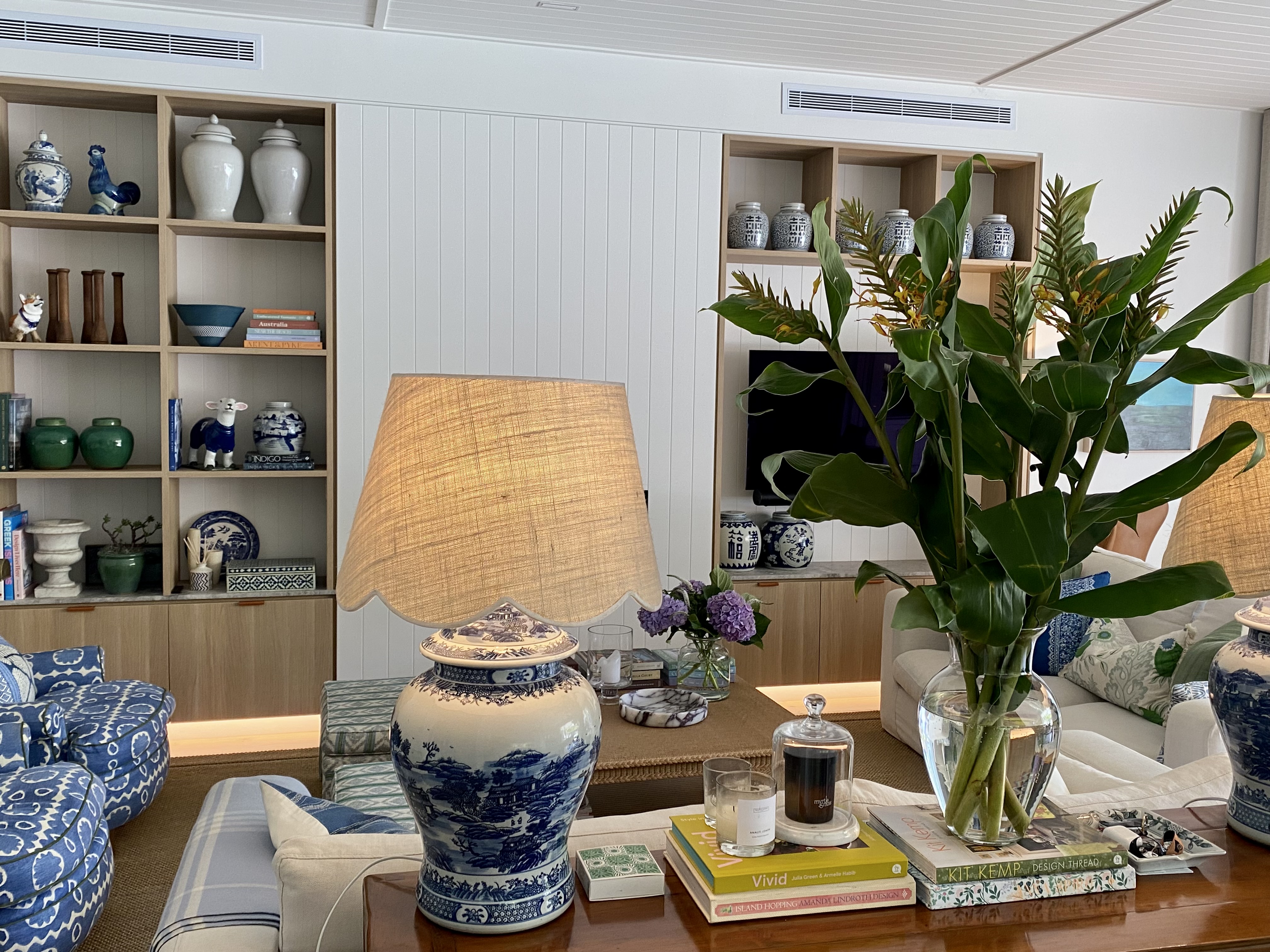 Open shelving styled with blue and white ginger jars and ceramics
