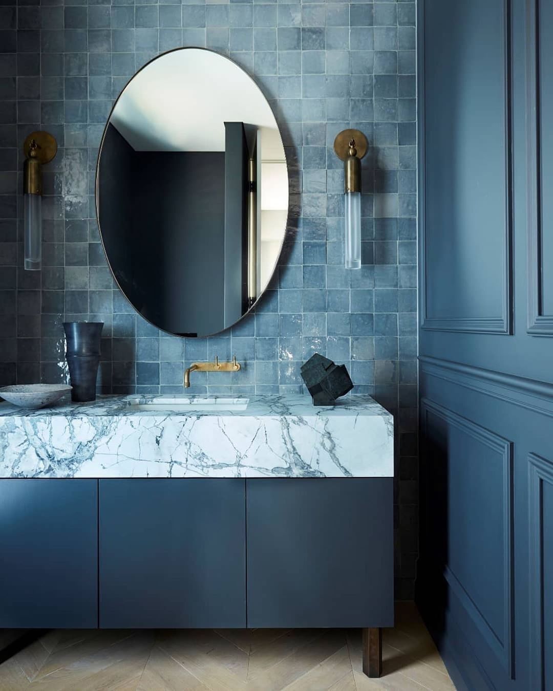 Blue zellige tiled powder room with marble vanity