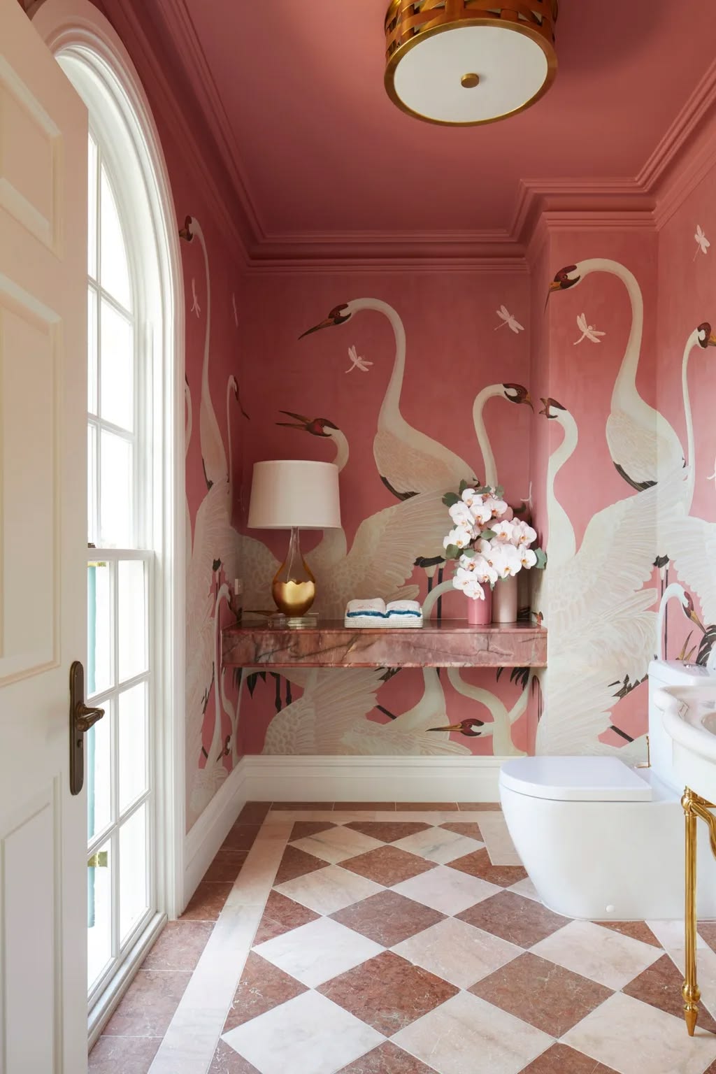Pink crane mural wallpaper powder room with marble checkerboard floor