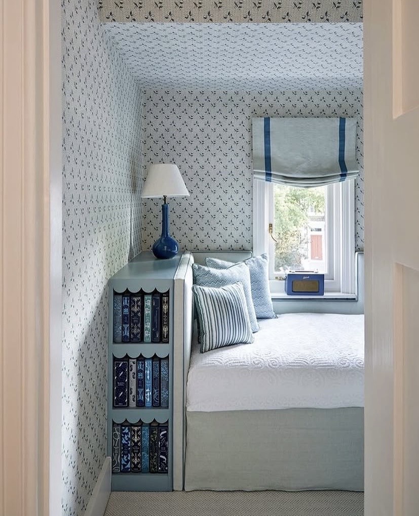 Bed nook with a built-in bookshelf unit doing double duty as a bedside cabinet, The Style Workshop