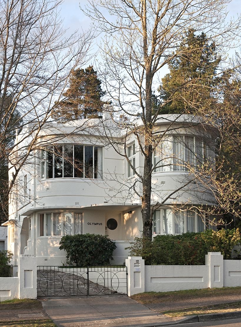 Art Deco home with smooth render, curved bay window and geometric forms