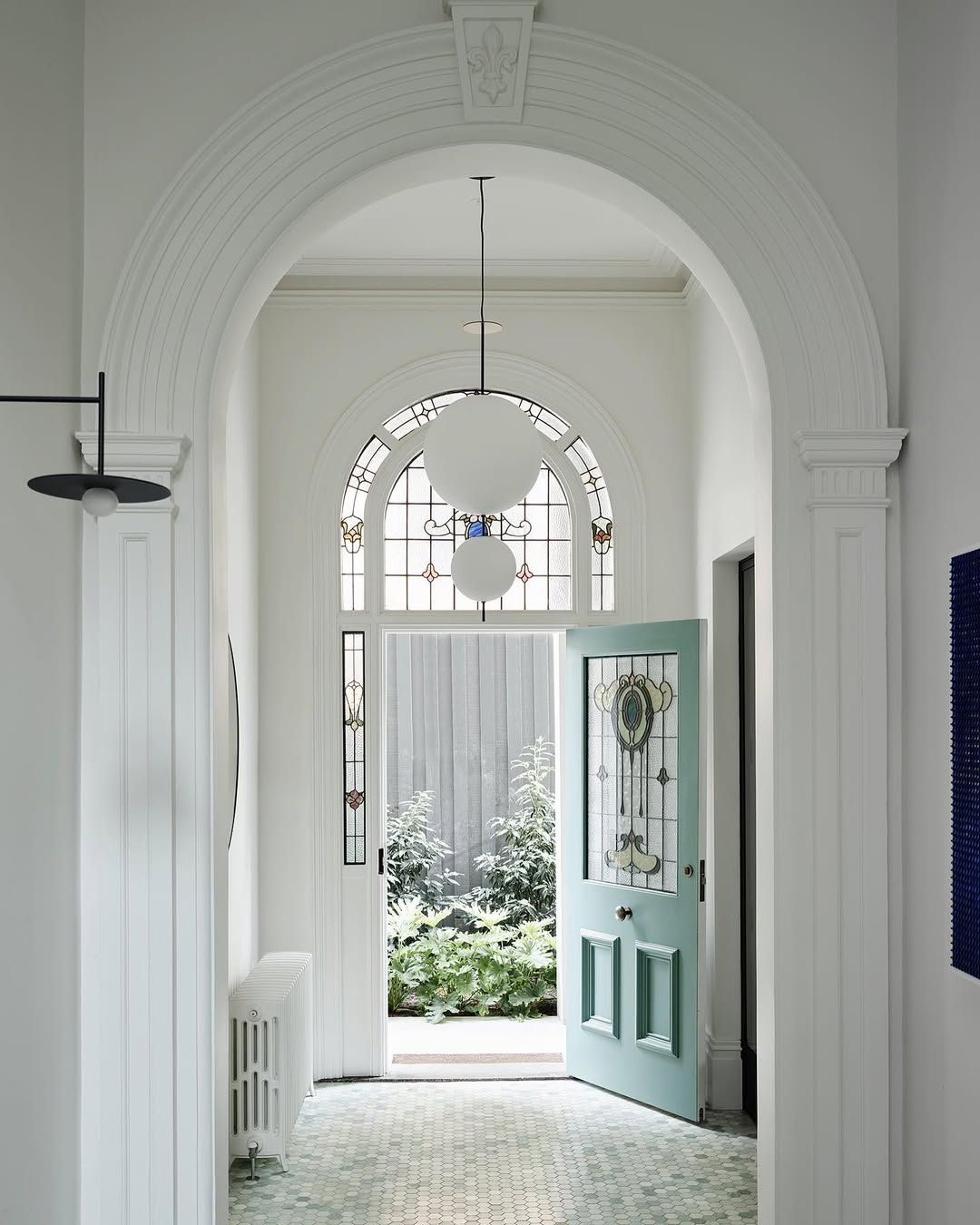 Federation hallway with original leadlight arch window, teal front door and tessellated tile floor
