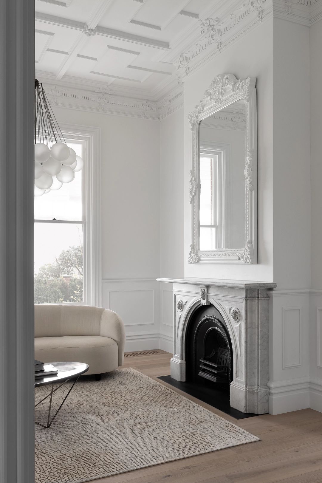 Federation interior with original marble fireplace, ornate plaster ceiling, coffered detail and timber floors
