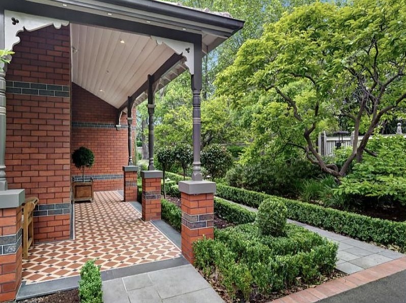 Federation verandah with original tessellated tiles, decorative fretwork brackets and cast iron posts