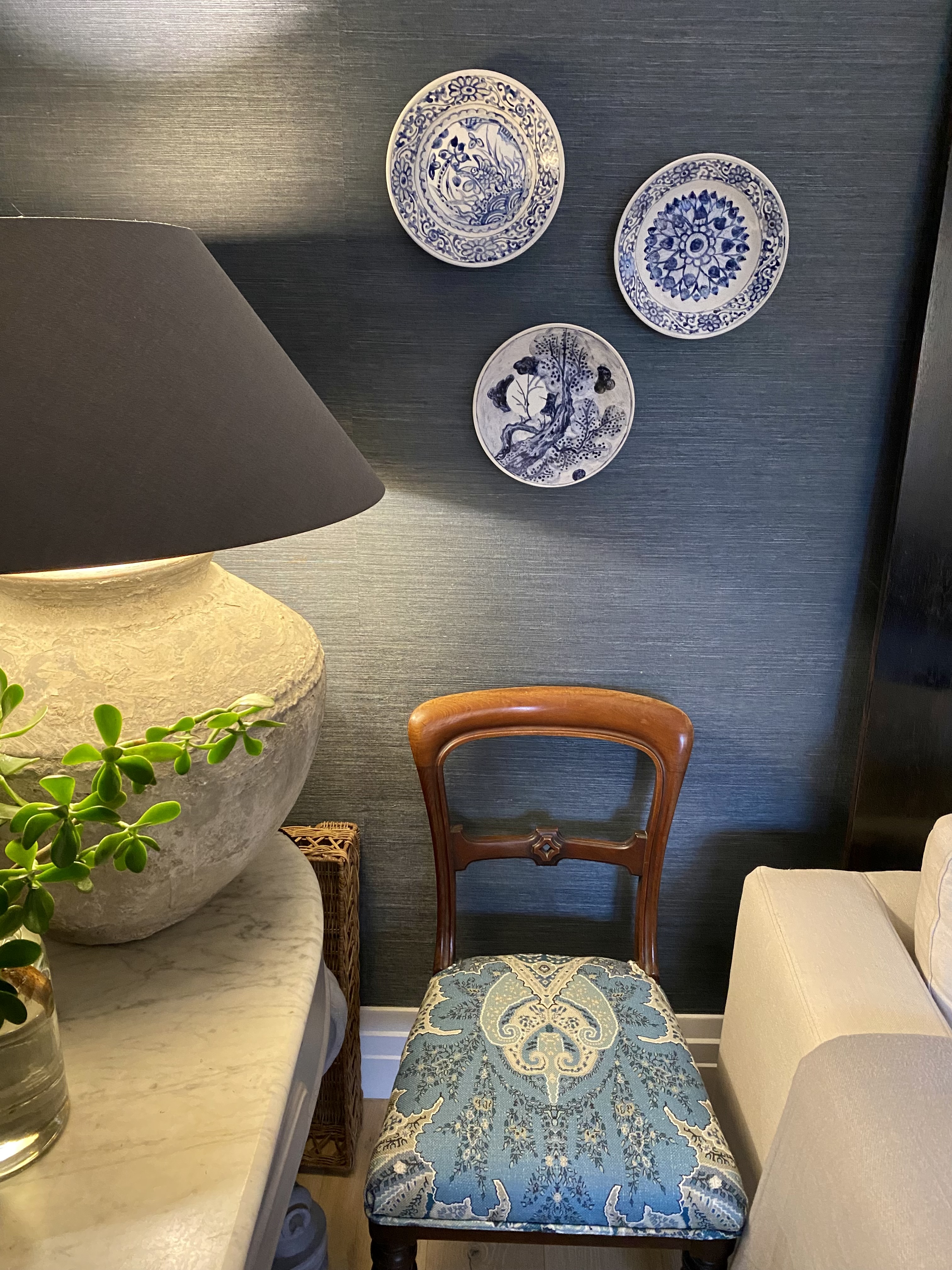 A table lamp casting warm light in a winter interior